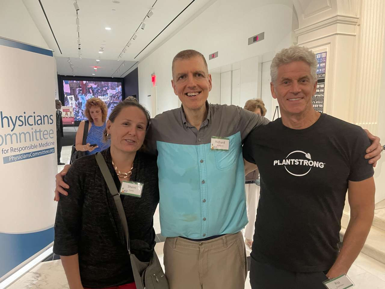 Chuck Carroll and Dr. Bsrnard pose with me holding my oversized pants!