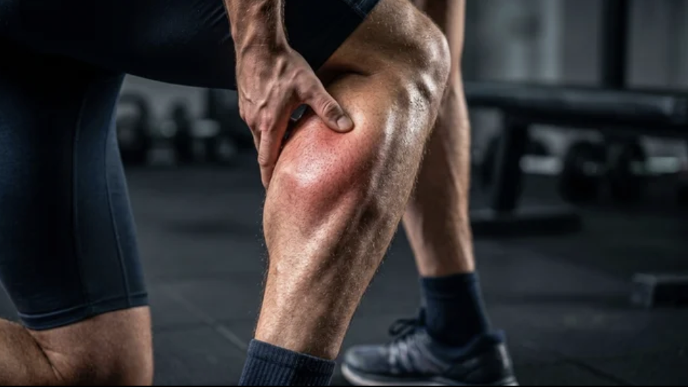 A knee is being worked on during a physical therapy sessionp